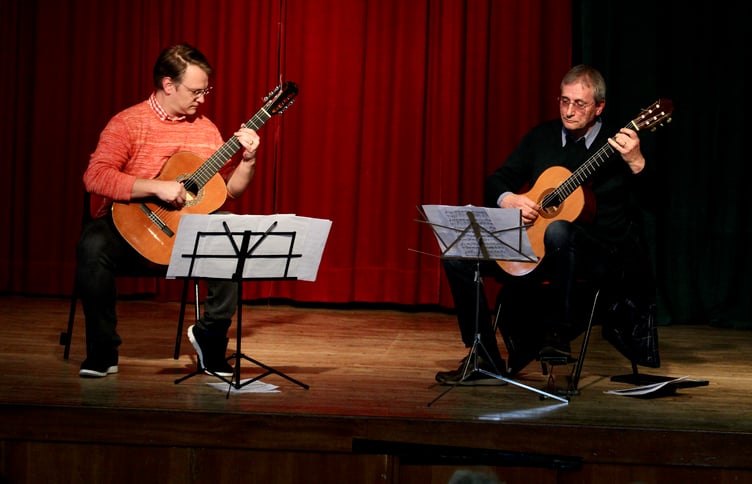 A guitar duet is performed on-stage