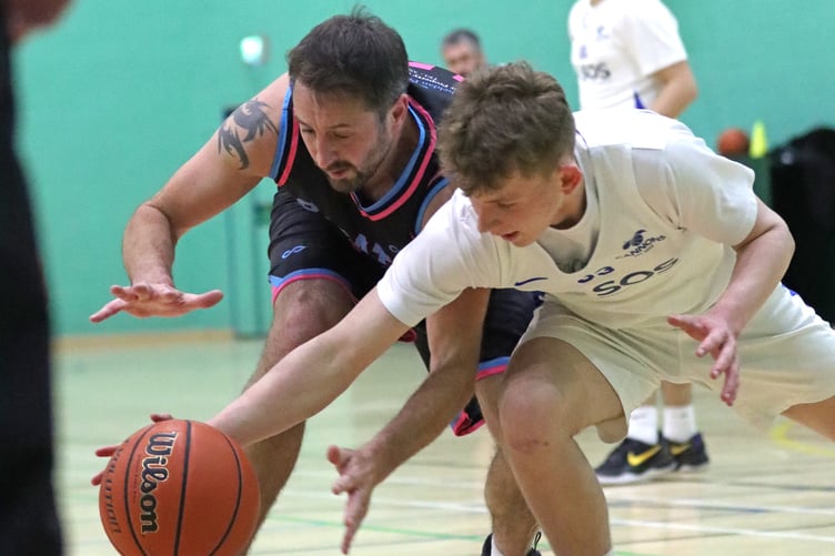 Rowan Coulter (right) and Jamie Grose fight for a loose ball in the Cannons v Pirates match-up at the NSC last week (Photo: Martin Dunne)