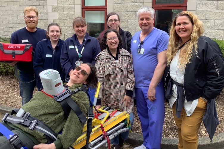Air ambulance staff attending a training day: Jon Booth (transfer practitioner), left, led the session, and Erica Bradley (transfer practitioner and registered nurse) models the device