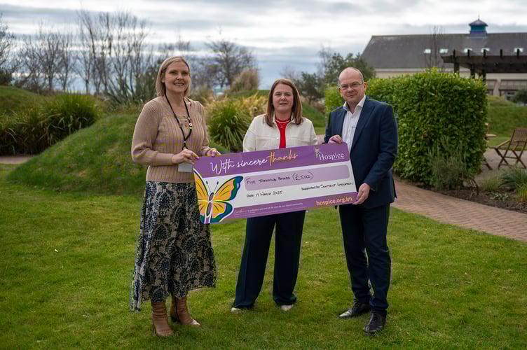 Client services director at Sentient International, Sharon Mellor (centre), presents a cheque for £5,000 to Vanessa Naude (left) and John Knight (Right) of Hospice Isle of Man