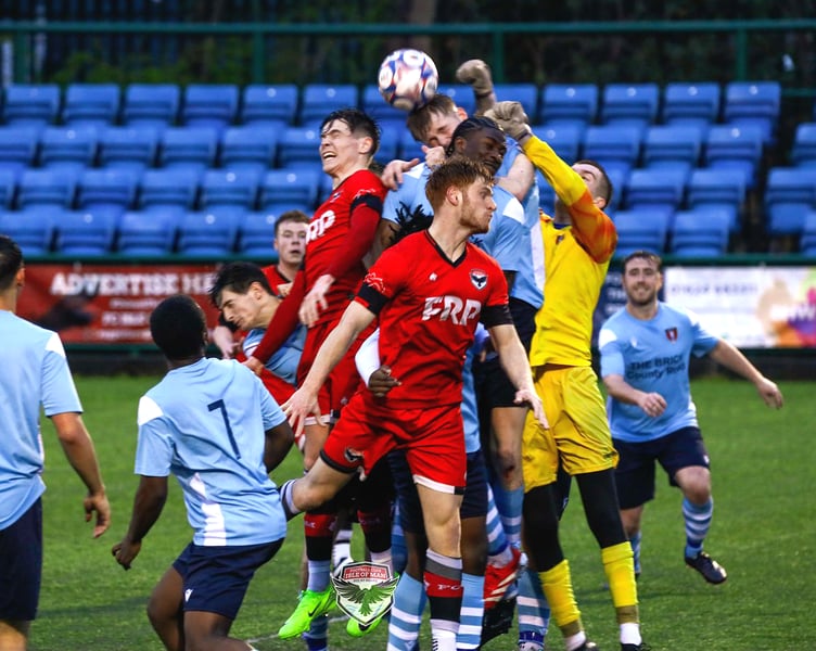 FC Isle of Man's Charlie Higgins (left) and Callum Sherry challenge the Litherland goalkeeper to an aerial ball during Saturday's clash at the Bowl (Photo: Hannah McHugh)