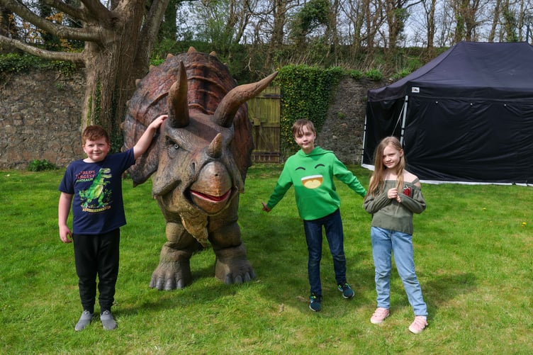 A dinosaur with three new friends