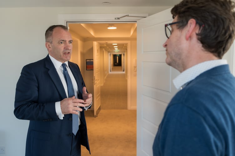 Chief Minister Alf Cannan (left) is given a tour of the new 37-apartment building Thie Clag in Douglas by Manx Development Corporation managing director Dane Harrop