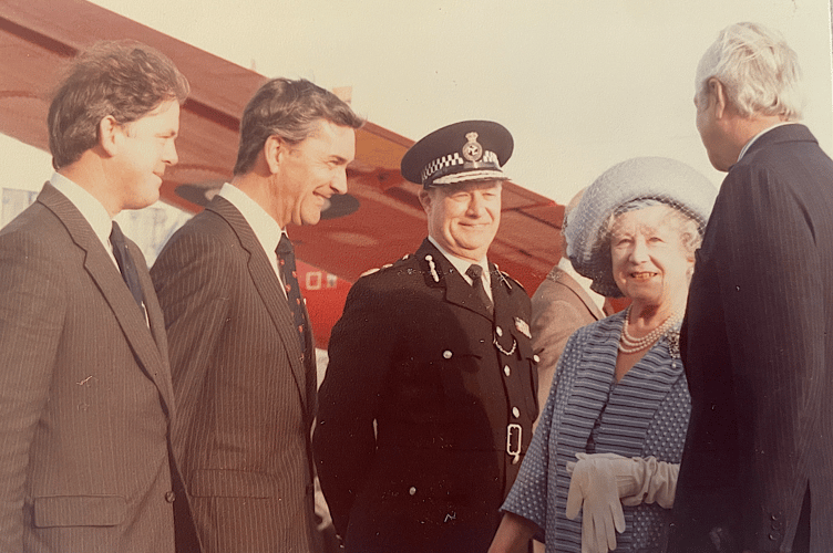 Then Government Secretary Peter Hulme  welcomes the Queen Mother to the island