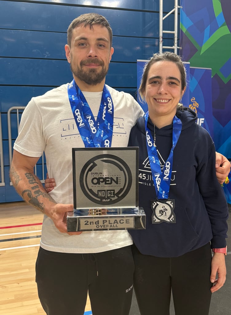 T45 Jiu-Jitsu Isle of Man coaches Myles Joughin and Catherine Moor with their medals and trophy from the IBJJF Dublin Open