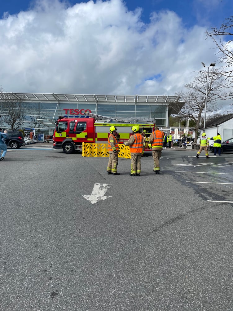 Fire service staff attend the incident at the Tesco supermarket in Victoria Road, Douglas this afternoon