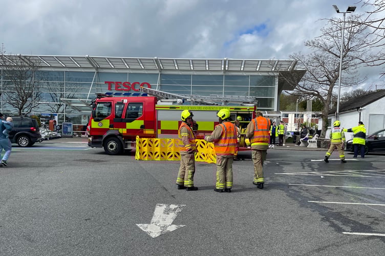 Fire service staff attend the incident at the Tesco supermarket in Victoria Road, Douglas this afternoon