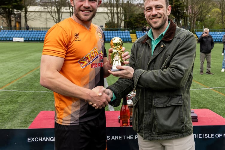 Ayre United's Shaun Kelly receives the man of the match award from a representative of competition sponsor ECAP (Photo: Gary Weightman)