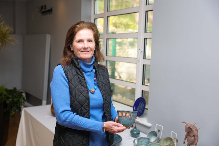 Susie Watson with her pottery and ceramics