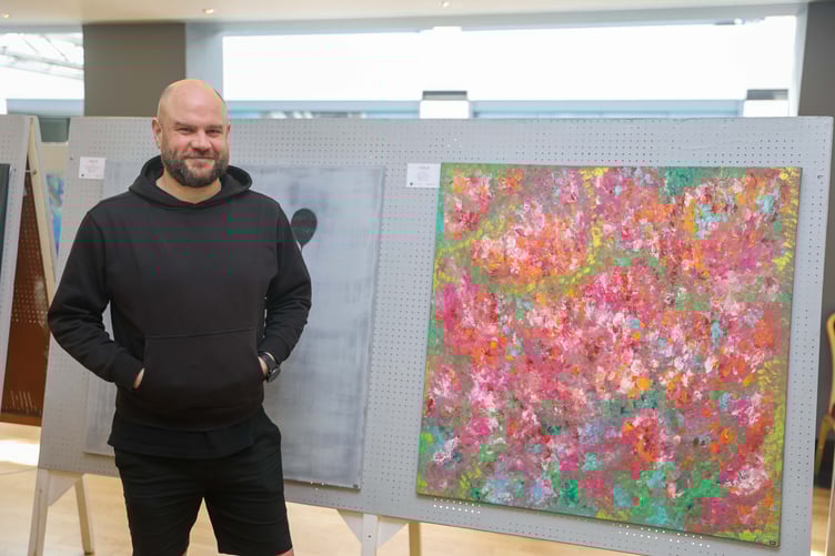 Monty Beaumont with his artwork