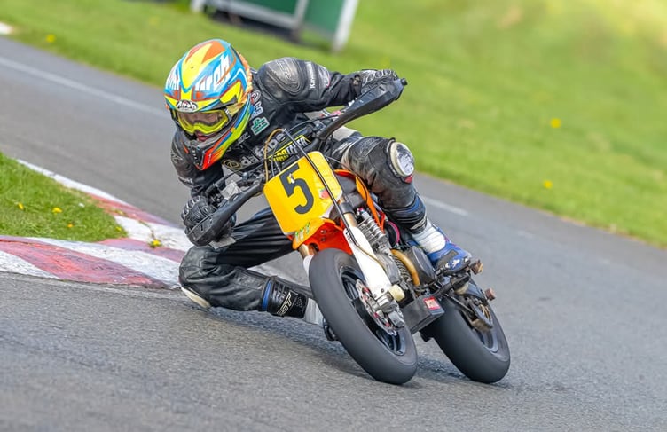 Jack Meechan gets his knee down on his way to winning the senior pitbike class in round two of the MRSports Championship at Jurby on Easter Sunday (Photo: John Faragher/Hagar Photography)
