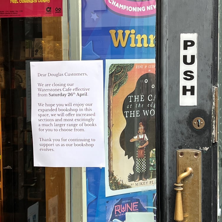 A sign on the door announcing the closure of the Waterstones cafe