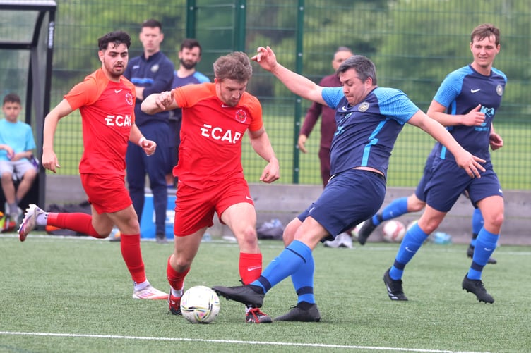 Sammy Gelling is challenged by a Halewood Apollo opponent during the two sides' friendly in Liverpool at the weekend (Photo: Paul Hatton)