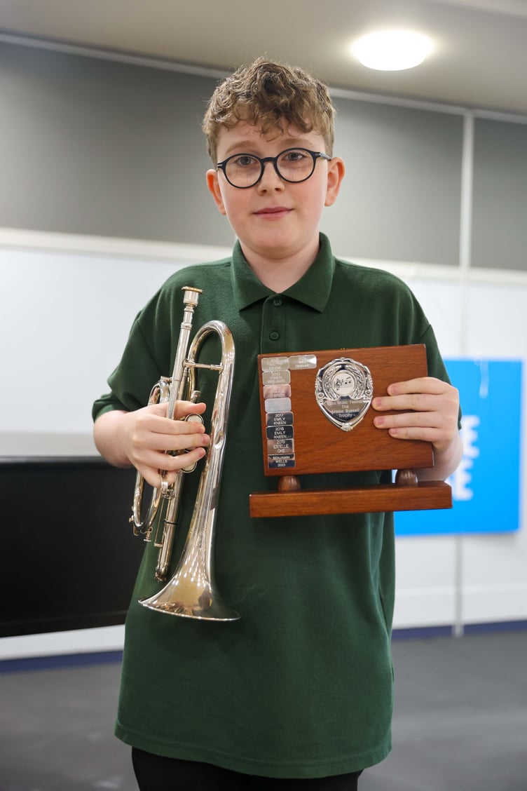 Teddy Price with his trophy and cornet