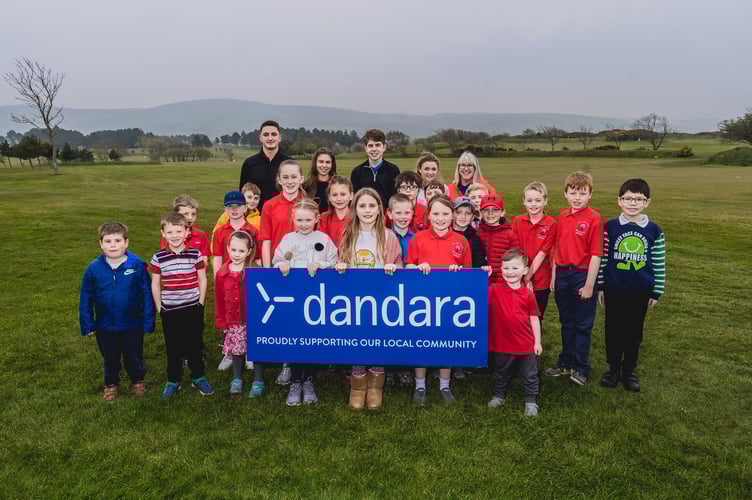 A fresh faced Lewis Dening (back left) with some of the island's junior golfers