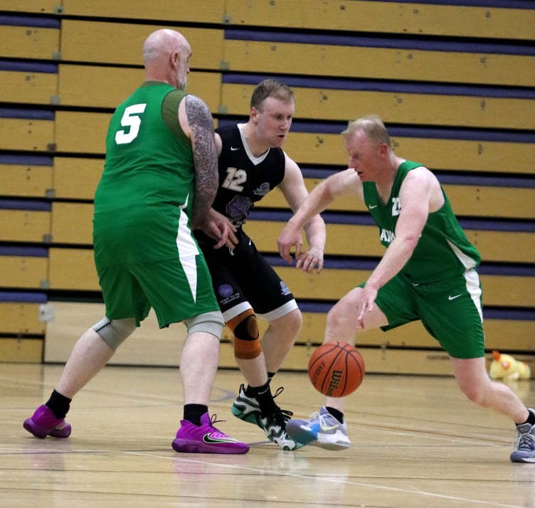Cavaliers' Dave Minay (left) sets a screen for team-mate Chris Wolfendale in their close semi-final against Jets at the NSC on Thursday evening (Photo: Seb Smith)