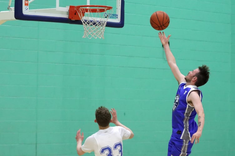 Wolves' Ben Campbell hits a fast break lay-up as Rowan Coulter chases down for Cannons (Photo: Seb Smith)