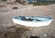 Vandals damage and sink small boat moored on remote beach