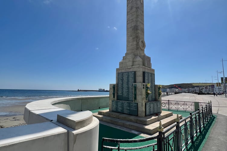 The sea wall curves around the Cenotaph
