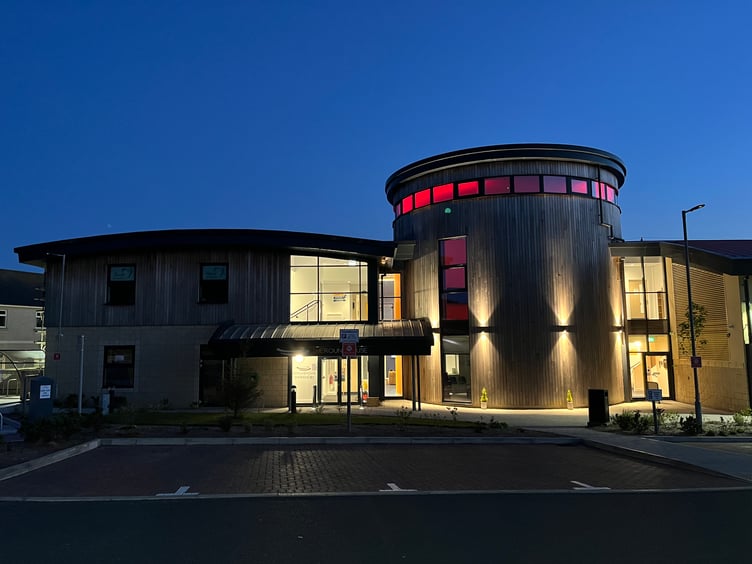 Braddan Roundhouse lit up in red to mark the 50th anniversary of the UCM campus