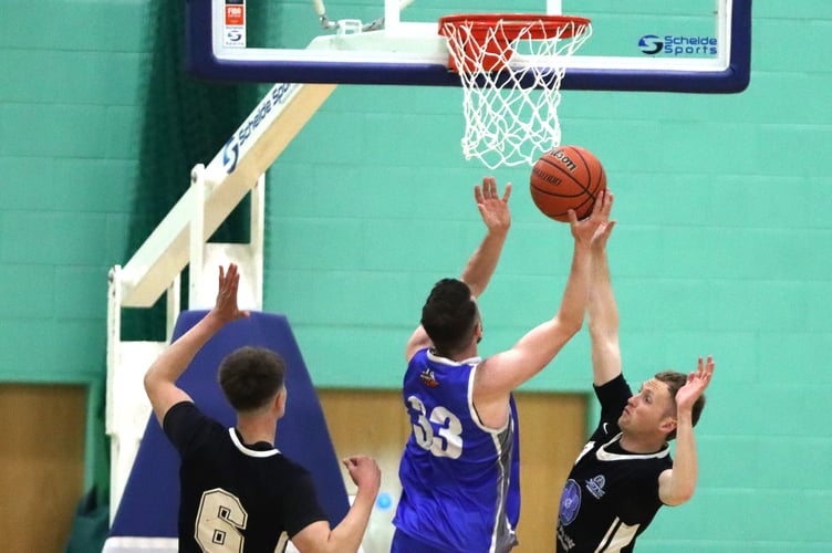 Player of the match Tom Dalton-Brown (right) of Jets attempts to block Viktor Capkanovski's route to the basket during Thursday evening's Championship final at the NSC
