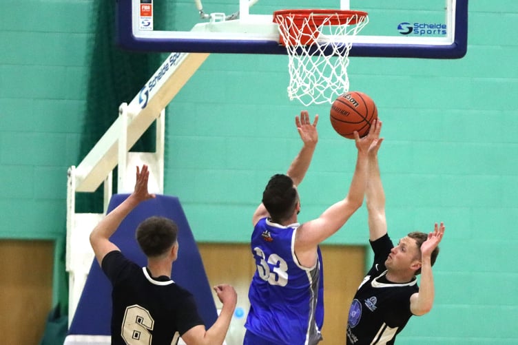 Player of the match Tom Dalton-Brown (right) of Jets attempts to block Viktor Capkanovski's route to the basket during Thursday evening's Championship final at the NSC