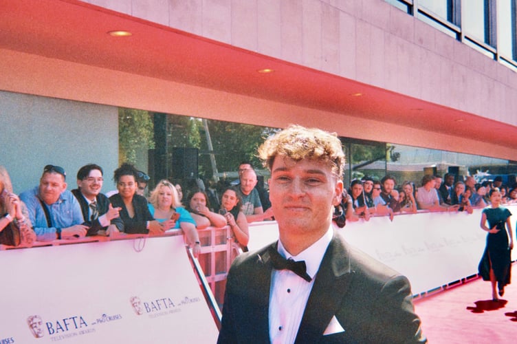 Sid Batty walking on the red carpet with his mental health duck Quack