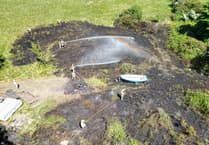 Warning after 15 firefighters called out to large blaze which scorched patch of land