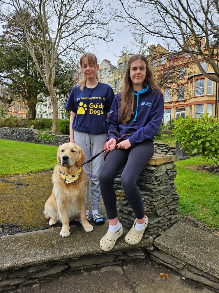 Emily and Katie Jacobs with their dog Dexter