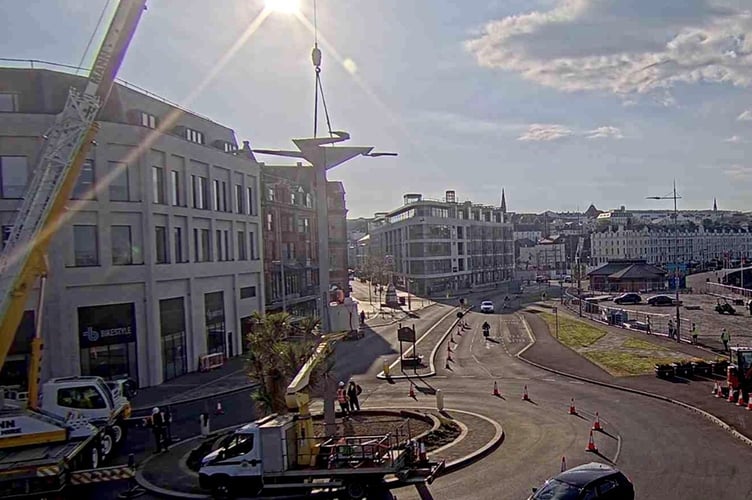Webcam footage of the Three Legs being craned into position