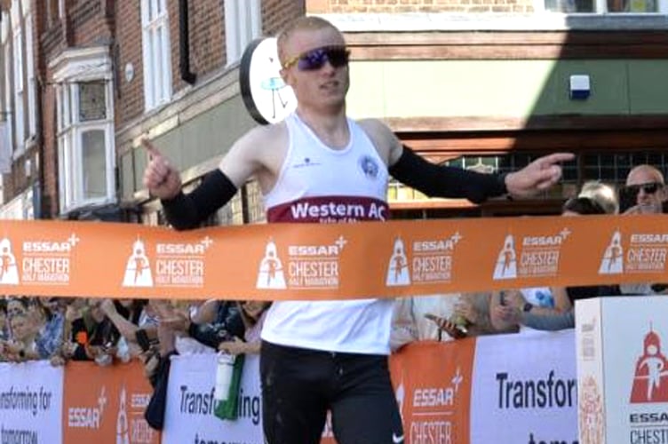 Western AC's Corrin Leeming breaks the tape to win the Chester Half Marathon last weekend