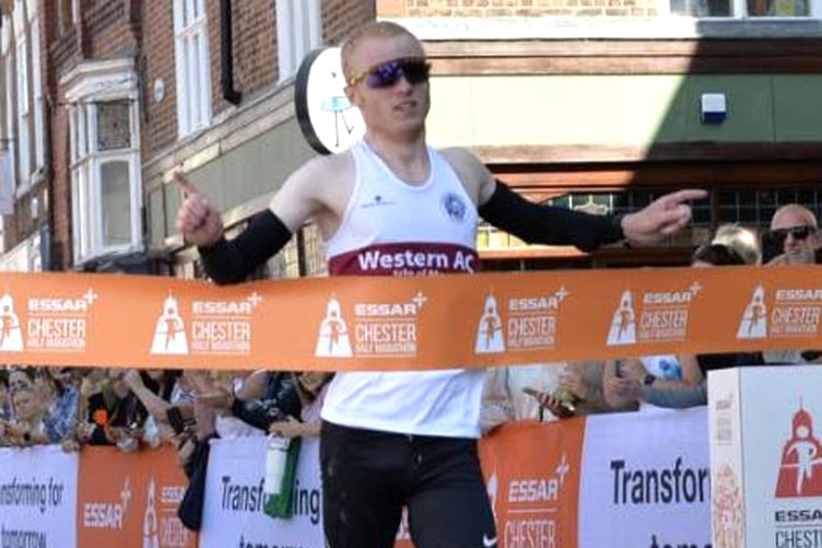 Western AC's Corrin Leeming breaks the tape to win the Chester Half Marathon last weekend