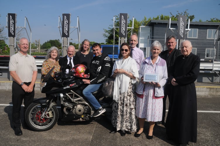 Close members of Mike Kelly's family, including his wife Pat (third from right), Mike's daughter Charlotte (with sunglasses), his brothers Juan and Rev. Brian Kelly, along with TT rider Joe Yeardsley who carried the casket containing his ashes on a final lap of the Mountain Course