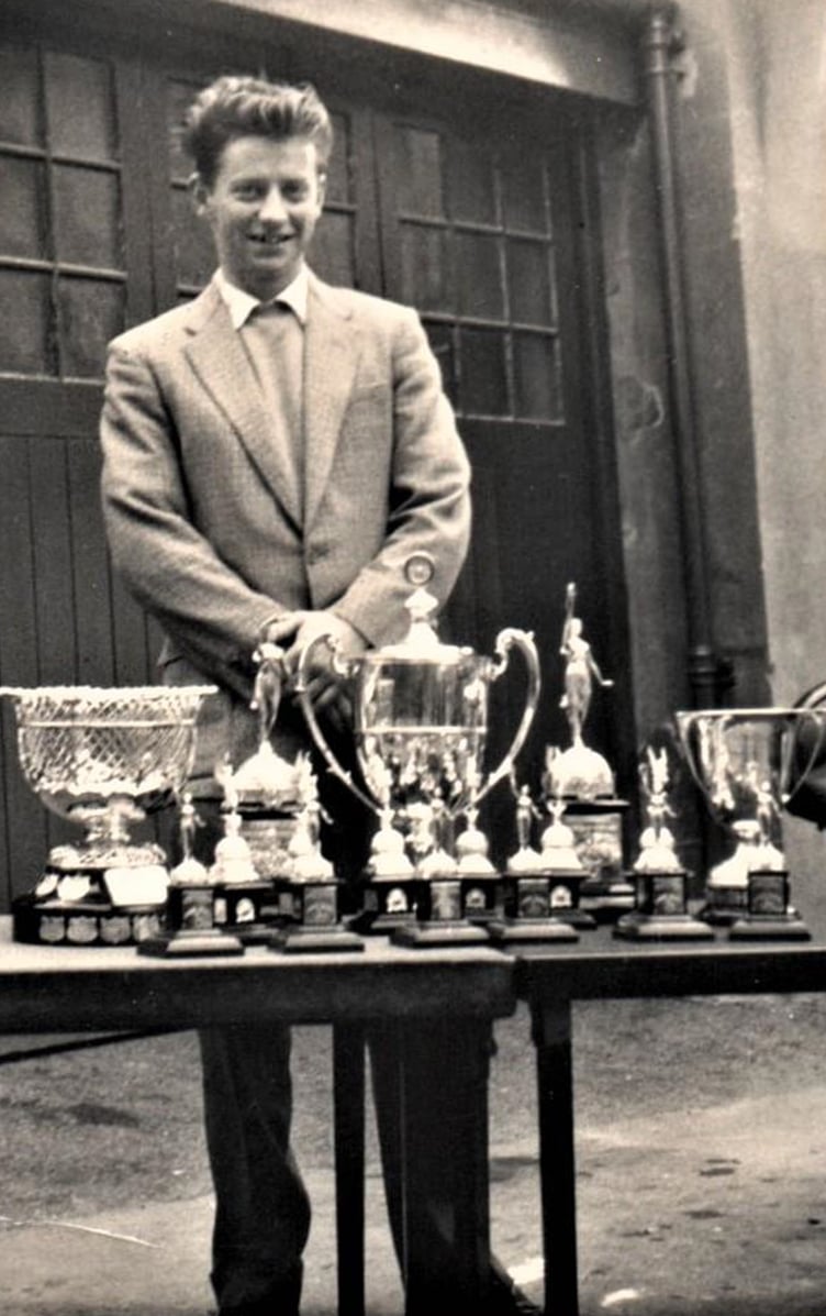 Mike with part of the haul of trophies won by Reg Deardon's team in the 1958 Manx Grand Prix