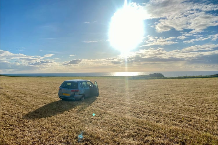A car crashed into a field on Sunday evening
