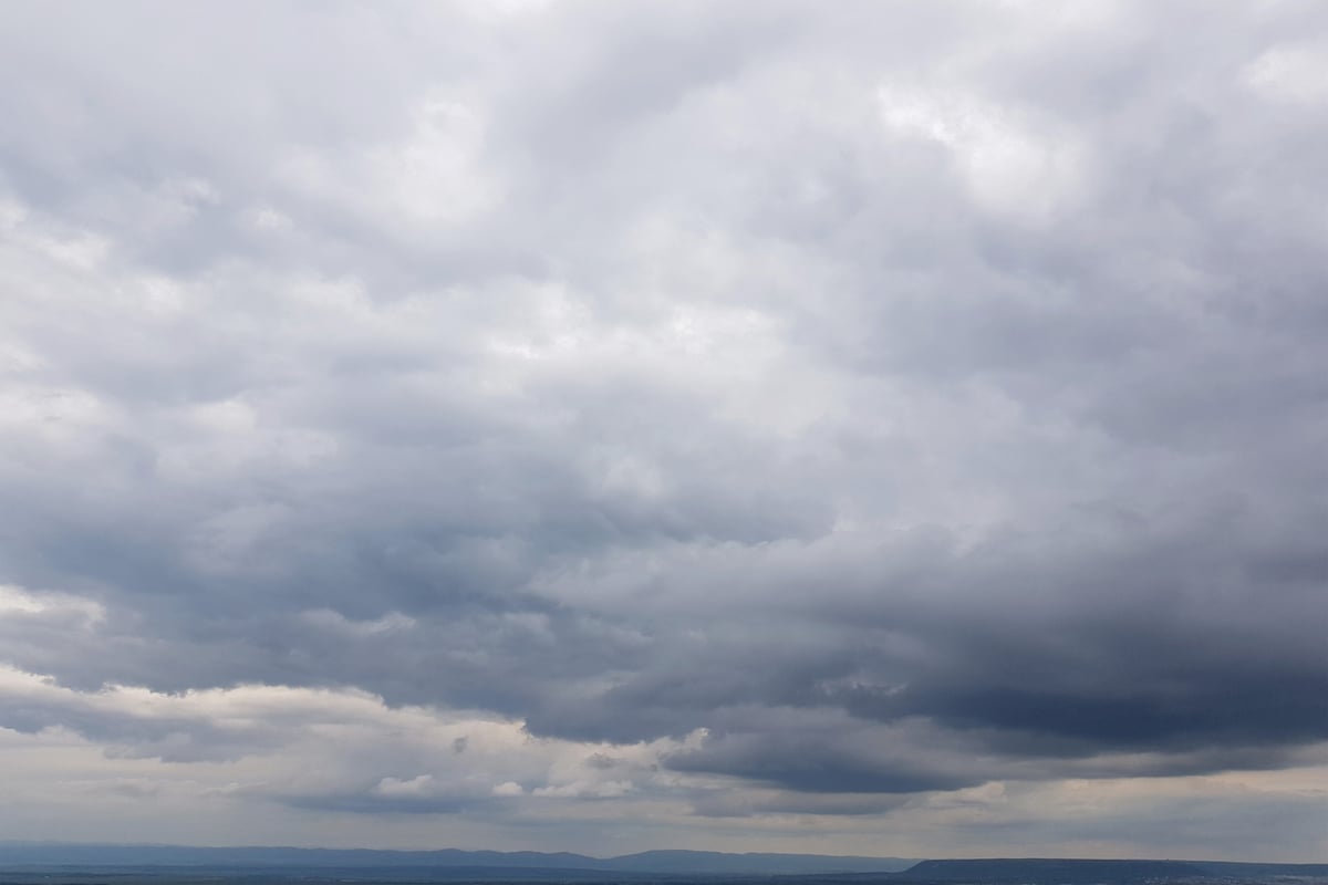 Partly cloudy today with patchy rain possible, sunny skies tomorrow