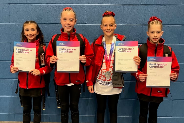 The Ellan Vannin Gymnastics Club quartet of Jessica Shannon, Ava Quirk, Chelsea D'Ottavio and Lora Markova with their performance certificates after impressing at the British Gymnastics National Finals in Stoke-on-Trent