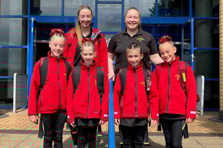 The four Isle of Man gymnasts - Jessica Shannon, Ava Quirk, Chelsea D'Ottavio and Lora Markova - with their coaches Stacey Saltwell-Garrett and Jenny Harris