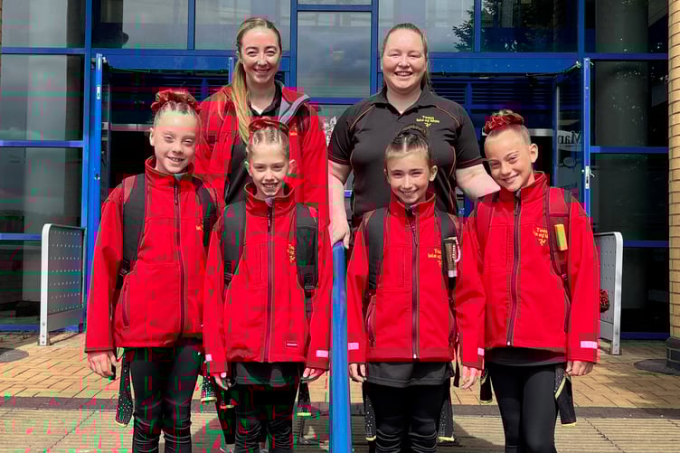 The four Isle of Man gymnasts - Jessica Shannon, Ava Quirk, Chelsea D'Ottavio and Lora Markova - with their coaches Stacey Saltwell-Garrett and Jenny Harris