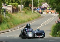 Isle of Man TT 2025: Dominant Crowes smash lap record on way to sidecar victory
