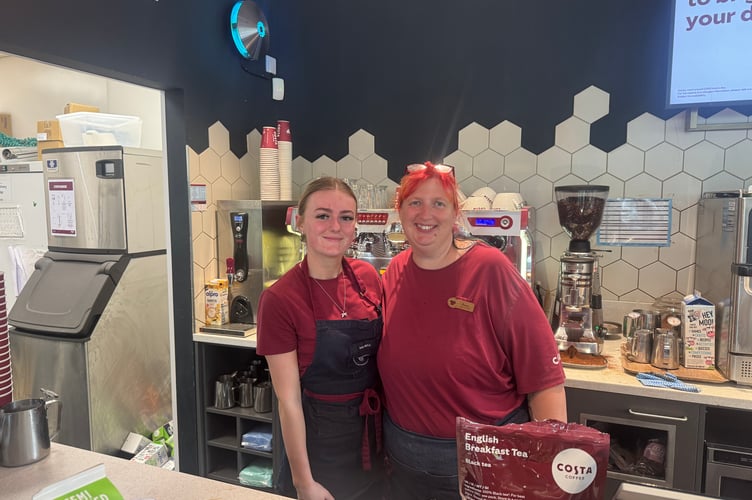 Manageress of the Costa in Crosby Emma Mullinor (right) stayed open overnight to offer a warm, dry space for campers staying nearby at Glenlough Campsite. Pictured with her is barista Daisy May (left)