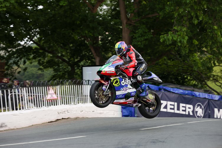 Mikey Evans flying over Ballaugh Bridge on Tuesday evening in the Metzeler Supertwin TT Race 1
