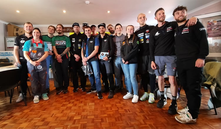 The 2025 recipients of the Hailwood Foundation financial awards are pictured in the centre at the rear of the TT Grandstand. The full list of recipients (left-right) are: Todd Ellis/Emmanuelle Clement, Bruno Mathern/Mathilda Jully, Erno Kostamo, Victor Lopez, Joe Yeardsley, Marcus Simpson, Gerald Dath (hidden), Julien Creigniot, Andrea Majola, Lancelot Unissart, Alice Smith, Loris Majcan, Steve Kershaw/Rhys Gibbons (Photo: Mike Hammonds)