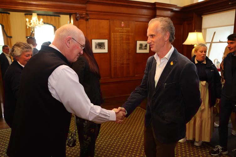 Isle of Man Examiner's very own John Watterson is greeted by Sir John Lorimer 
