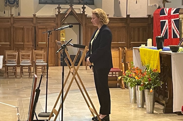 Karolina Davison, originally from Ukraine, pays tribute to Chris at St German's Cathedral in Peel