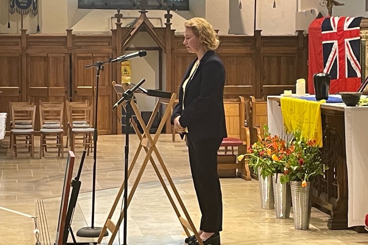 Karolina Davison, originally from Ukraine, pays tribute to Chris  at St German's Cathedral in Peel