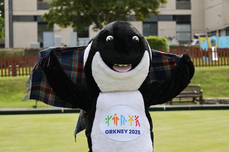 Orkney Games mascot Ola the Orca with the specially designed Games tartan