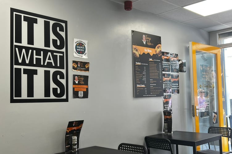 The 'It is what it is' sign inside Terry's Tatos