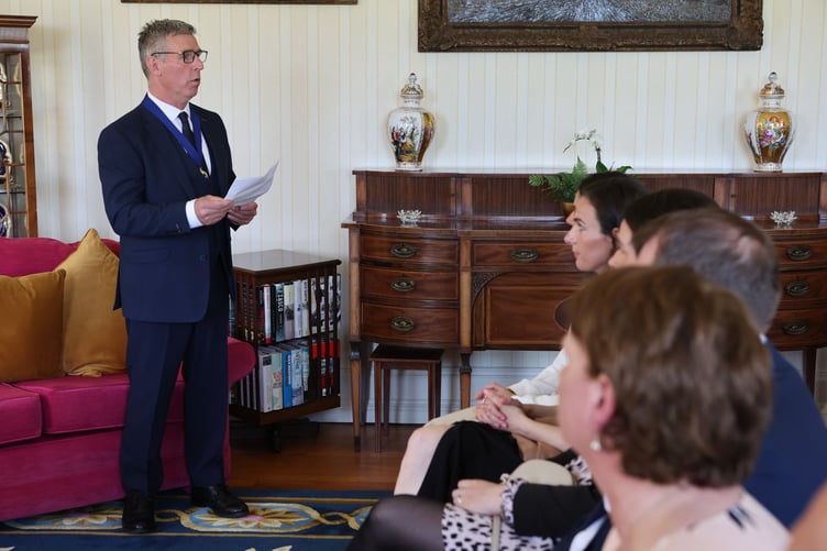 Mr Teare provides a speech