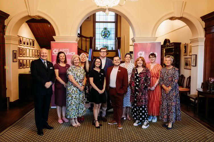 Current members of the Arts Council inside Government House with Sir John Lorimer and Lady Lorimer